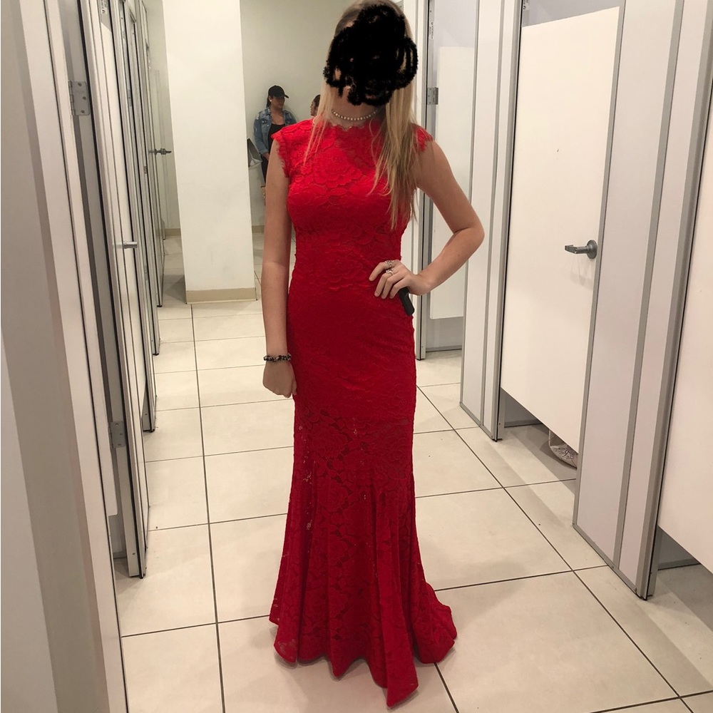 Formal dress. Slightly see through in the abdomen, upper chest, and the bottom.